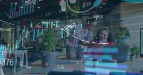 Women Analyzing Financial Data in Modern Office Environment