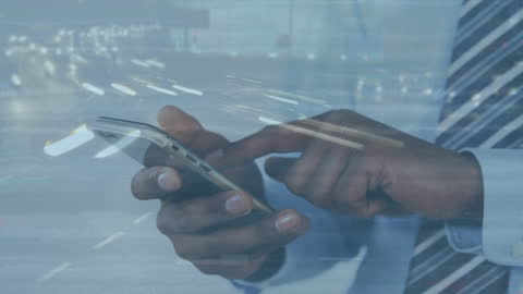 Double Exposure of Businessman Using Smartphone with City Traffic
