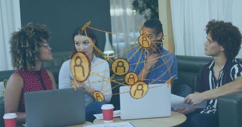 Multiethnic team collaborating with laptops and network overlay for modern remote teamwork
