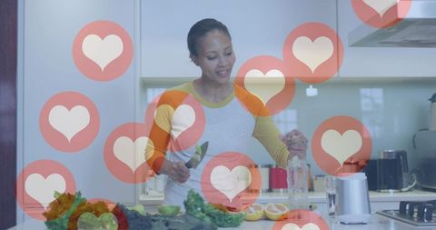 Happy Woman in Modern Kitchen Surrounded by Social Media Hearts