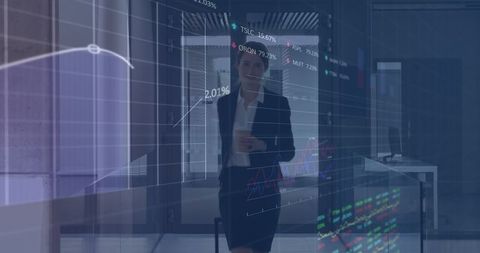 Businesswoman Interacting with Data Interface in Modern Office