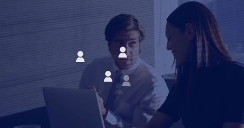 Business collaboration at laptop, manager in tie explaining data to colleague in office