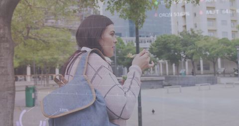 Woman Eating Salad While Walking with Digital Data Overlay - Download Free Stock Images Pikwizard.com