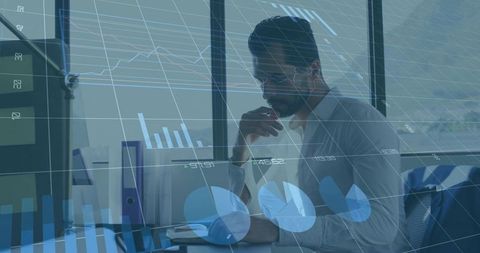 Analyzing Financial Trends in Modern Office with Charts Overlay