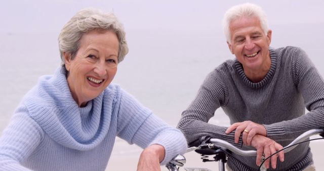 Senior Couple Enjoying Bicycling at the Beach - Download Free Stock Images Pikwizard.com