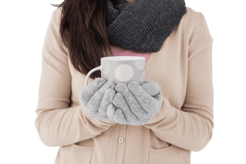 Young Woman Holding Transparent Ceramic Mug in Gloved Hands