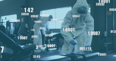 Healthcare workers disinfecting gym for covid-19