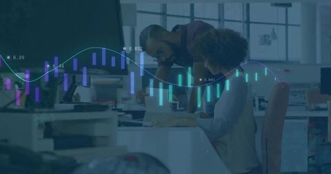 Coworkers Analyzing Data with Graphs in Modern Office Setting