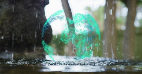 Hovering holographic green wireframe globe over rainy forest puddle connecting tech and nature
