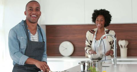 African American Couple Enjoying Cooking in Modern Kitchen - Download Free Stock Images Pikwizard.com