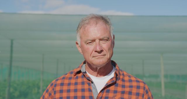 Senior Man Outdoors in Farm, Standing and Looking at Camera - Download Free Stock Images Pikwizard.com