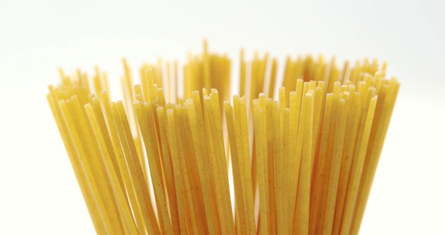 Close-Up of Uncooked Italian Pasta Sticks on White Background - Download Free Stock Images Pikwizard.com