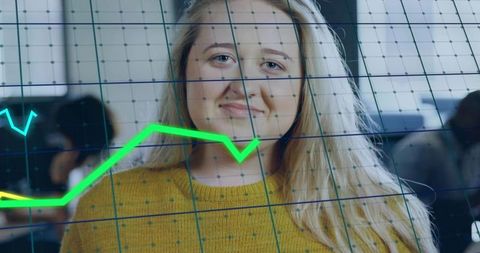 Businesswoman Analyzing Data with Trend Graph Overlay in Office