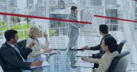 Multiethnic Team Analyzing Financial Data in Modern Office