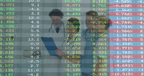 Healthcare Professionals Analyzing Financial Charts with Data Overlay