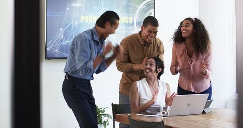 Diverse Team Celebrating Successful Business Meeting