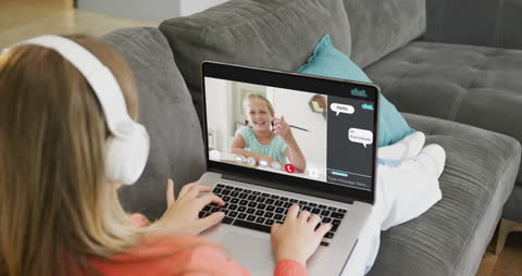 Girl Using Laptop for Online Learning and Video Chat