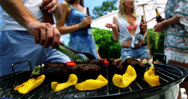 Friends Enjoying Barbecue Together Outdoors with Beer - Download Free Stock Images Pikwizard.com