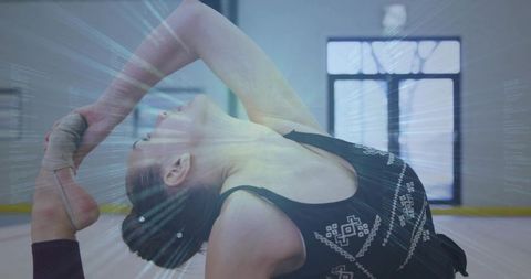 Teen Dancer Practicing Backbend in Studio with Animated Light Effects