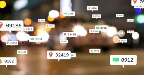 Nighttime urban location pins and notification icons floating over blurred traffic bokeh