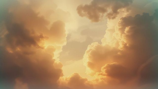 Golden sunrise through dramatic cumulus clouds