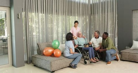 Diverse group and nurse greeting new treatment center patient