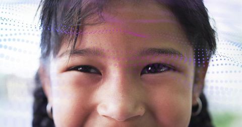 Close-up Smiling Child with Braided Hair and Purple Dot Overlay for Technology and Family