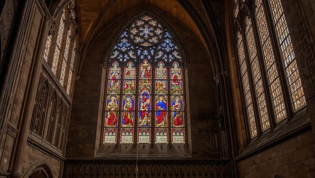 Vibrant stained glass illuminating cathedral interior