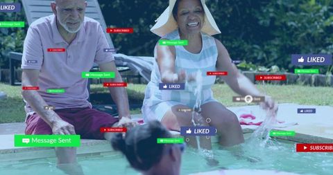 Joyful senior couple splashing pool water with grandchild, social likes, messages