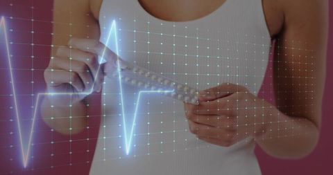 Woman holding blister pack showing ecg hologram grid, healthtech contraception telemedicine concept