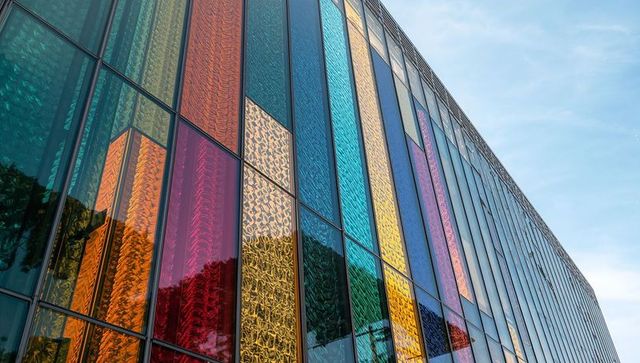 Modern architectural facade with multicolored glass panels