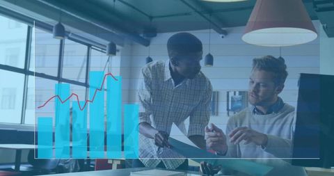 Professionals Analyzing Financial Charts in Modern Office Environment