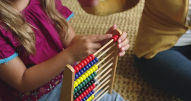 Child Learning to Use Wooden Abacus with Adult Guidance - Download Free Stock Images Pikwizard.com