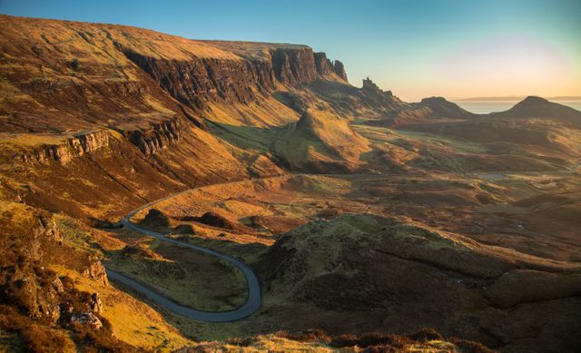 Scenic Landscape of Winding Road Through Scottish Highlands at Sunset - Download Free Stock Photos Pikwizard.com