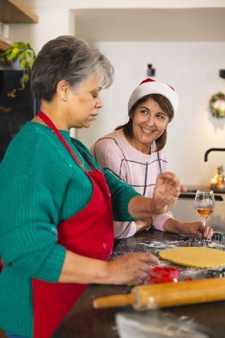 Mother and daughter celebrating holidays with fun baking activity