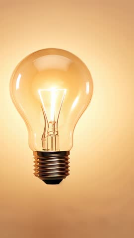Glowing Filament Bulb Switching On in Vertical Video with Warm Ambient Lighting