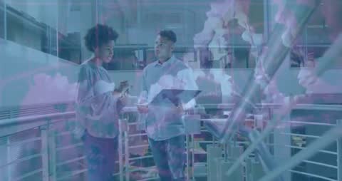 Collaborative Team Discussing Digital Charts in Modern Office