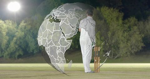 Global cricket night scene: batsman standing by stumps with world map globe overlay
