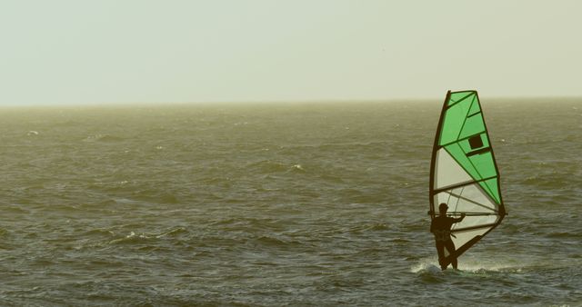 Windsurfer on Calm Sea at Sunset - Download Free Stock Images Pikwizard.com