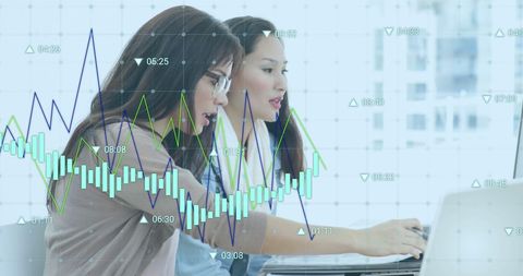 Businesswomen Analyzing Financial Data with Graph Interface