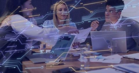 Team collaborating in futuristic office environment with tech overlay