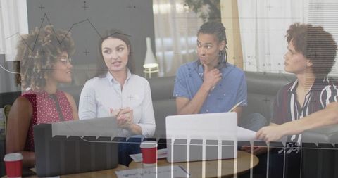 Diverse Team Brainstorming and Collaborating in Modern Workspace