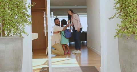 Happy Family Bids Daughter Goodbye at Home Entrance