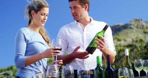 Couple Enjoying Wine Tasting in Lush Vineyard Landscape - Download Free Stock Images Pikwizard.com