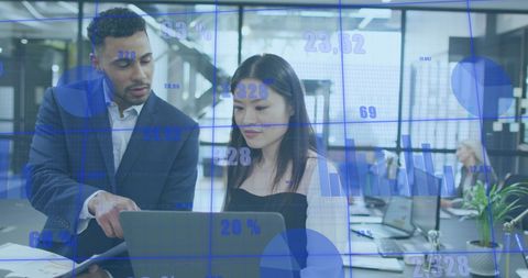 Diverse Team Analyzing Digital Graphs in Modern Office