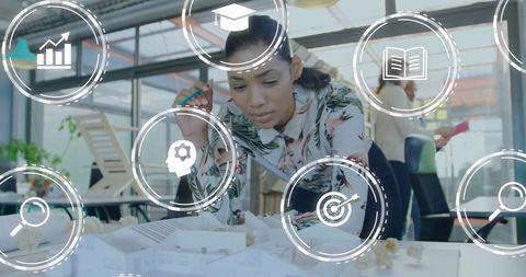 Focused Businesswoman Analyzing Architectural Model Concept