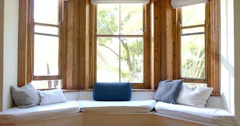 Cozy Window Seat with Rustic Wood Trim and Cushions - Download Free Stock Images Pikwizard.com