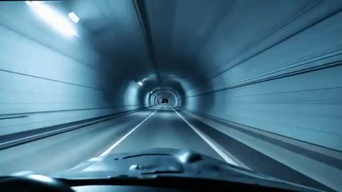 Driving Through Illuminated Tunnel from Car Dashboard Perspective