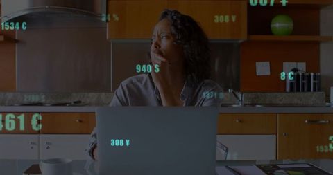 Businesswoman Contemplating Currency Exchange at Digital Workspace