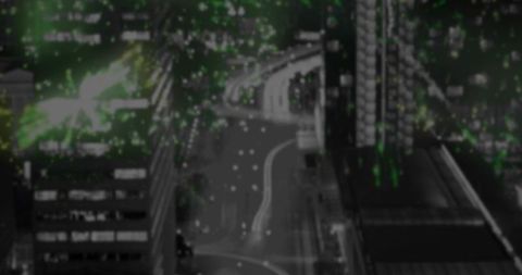 Dynamic Nighttime Cityscape with Light Trails Near Intersection